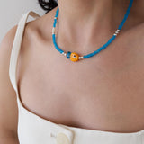 Blue Glass Beaded Fish Necklace With Orange Glass Fish Charm