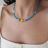 Blue Glass Beaded Fish Necklace With Orange Glass Fish Charm
