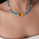 Blue Glass Beaded Fish Necklace With Orange Glass Fish Charm