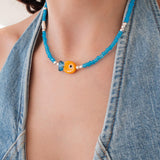 Blue Glass Beaded Fish Necklace With Orange Glass Fish Charm