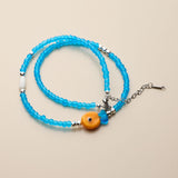 Blue Glass Beaded Fish Necklace With Orange Glass Fish Charm