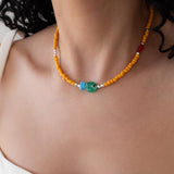 Orange Glass Beaded Fish Necklace With Green Glass Charm