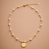 Gold Phaistos Disc Necklace, Pearl And Howlite Beaded Choker